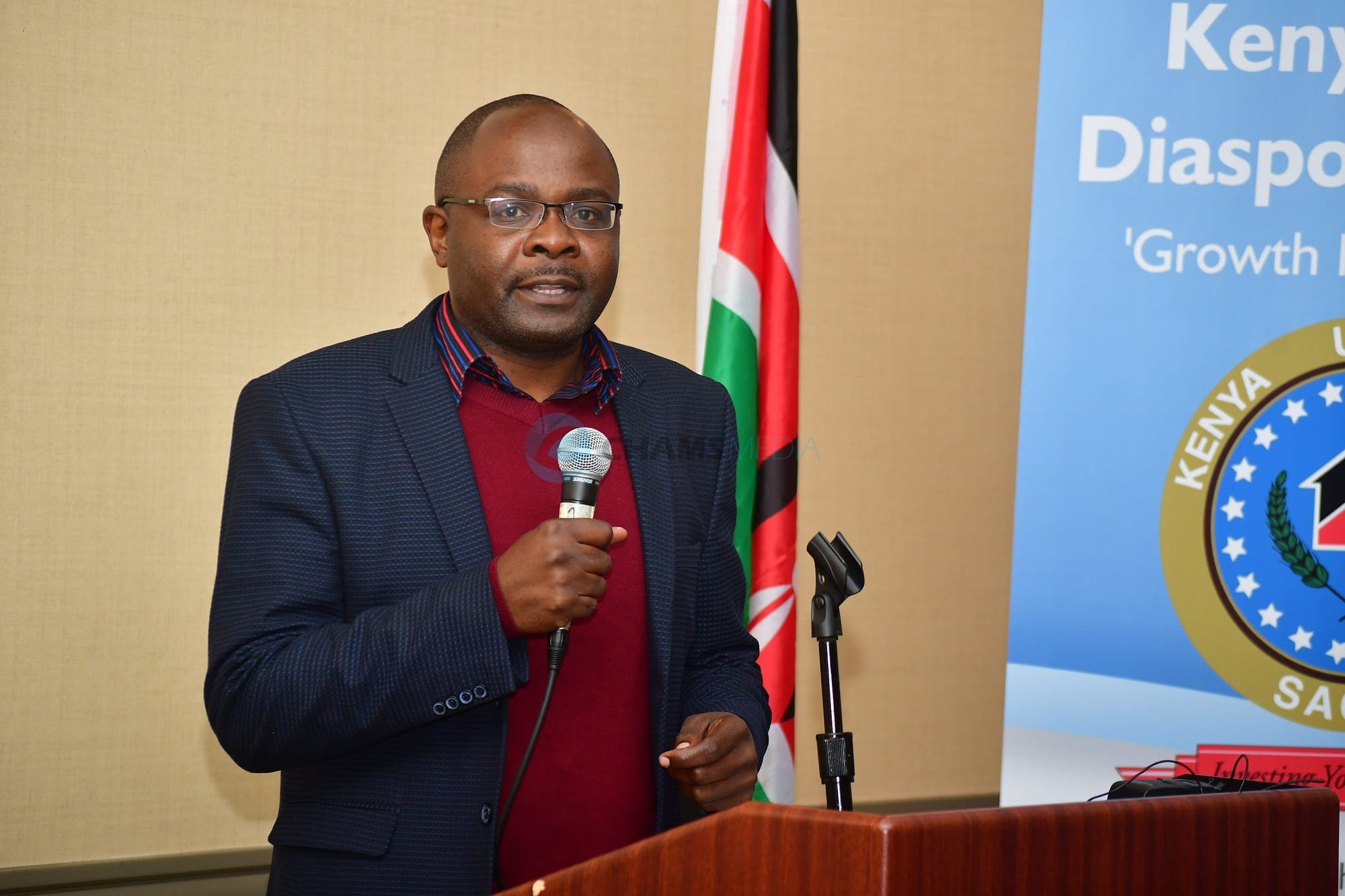 CHAMS Media CEO Alex Chamwada addressing Kenya-USA Diaspora Sacco AGM In Seattle City, June 2028
